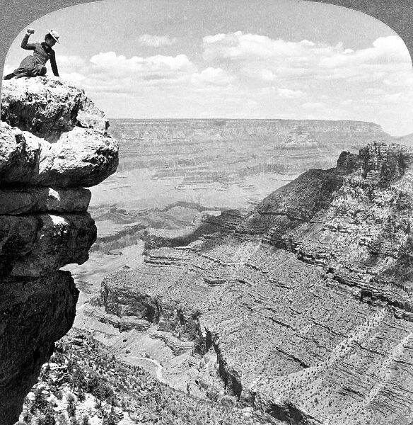GRAND CANYON, c1903. A woman seated on a cliff overlooking the Grand Canyon in Arizona