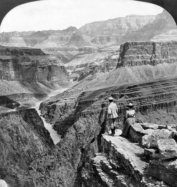 GRAND CANYON: SIGHTSEERS. A man and a woman looking out across the Granite Gorge