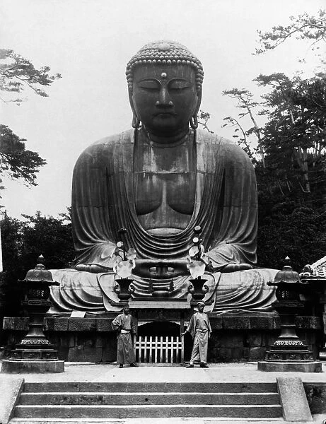 The Great Buddha of Kamakura, a bronze statue cast in 1252. Photograph, July 1900, by an unidentified Danish photographer. The man on the right is an English friend in Japanese clothing