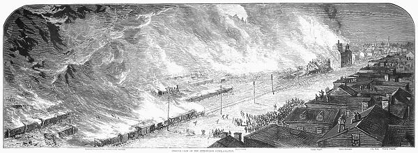 GREAT RAILROAD STRIKE, 1877. Burning railroad cars and depots create a wall of fire in Pittsburgh, Pennsylvania, 21-22 July 1877. Wood engraving from a contemporary American newspaper