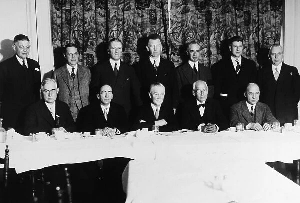 Group portrait of notable figures in attendance at the annual luncheon of the Sportsmanship Brotherhood in New York City, 29 December 1930, including (seated) Fielding Yost, Athletics Director of the University of Michigan (left) and Charles W. Kennedy of Princeton, President of the National Collegiate Athletic Association (right)