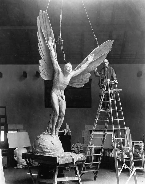 GUTZON BORGLUM (1867-1941). American sculptor. Borglum with his sculpture, Statue of Aviator