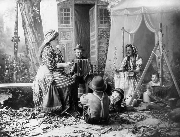 GYPSYIES, c1902. Happy Romanies. A staged rendition of musicians in a gypsy camp