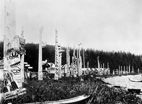 HAIDA VILLAGE, c1880. Totem poles and canoes in the Haida village of Skidegate