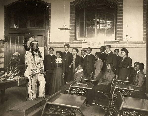 HAMPTON INSTITUTE, c1899. Louis Firetail, a Crow Creek Sioux man, wearing tribal clothing