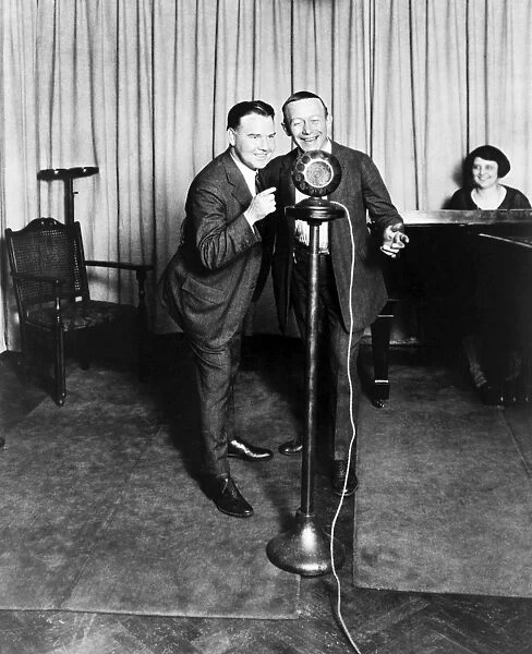 HAPPINESS BOYS, 1923. Singers Billy Jones and Ernie Hare performing on the radio