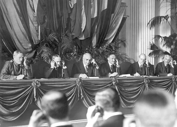 Harding speaking with President Mario Garcia Menocal of Cuba from the Pan American Union at Washington, D. C. at the formal opening of telephone communication between the United States and Cuba, 11 April 1921. Left to right: John J. Pershing; Carlos de Cespedes; President Harding; L. S. Rowe; Charles Evans Hughes; and Andrew Mellon