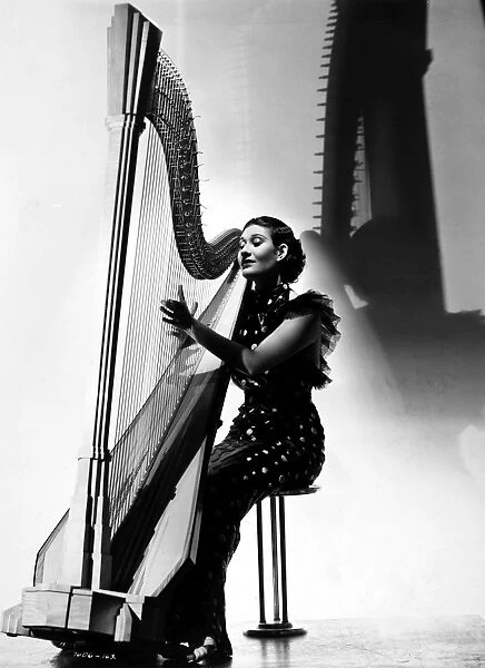 HARPIST, 1935. Harpist Lysbeth Hughes. Photograph, 1935