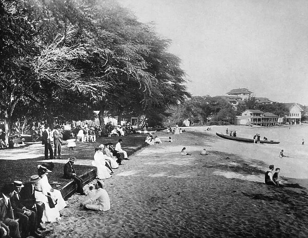 HAWAII: BEACH, c1914. Vacationers on Waikiki Beach, Oahu, Hawaii, c1914. The Moana Hotel is in the background