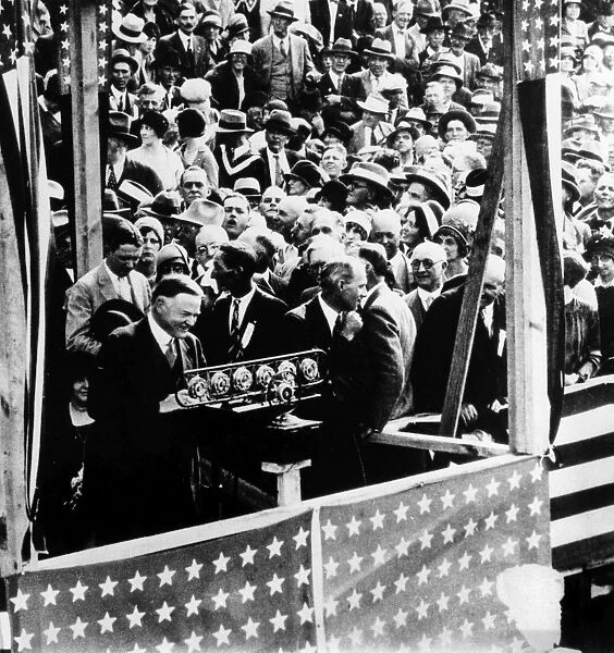 HERBERT HOOVER (1874-1964). 31st President of the United States. Hoover (at microphone) delivering a nationally broadcast speech before a crowd in Elizabethton, Tennessee, while campaigning as the Republican presidential candidate, 6 October 1928