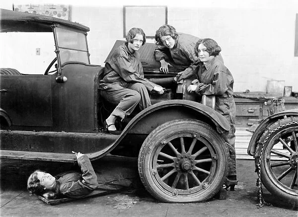 HIGH SCHOOL MECHANICS, 1927. A group of high school girls learning automobile mechanics at Central High School in Washington, D. C. 1927