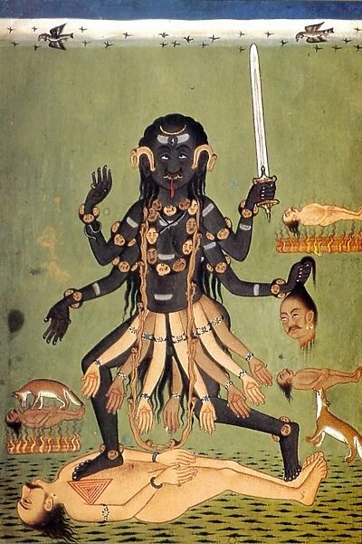 HINDU GODDESS: KALI. Holding a sword and a severed head, Kali dances on top of