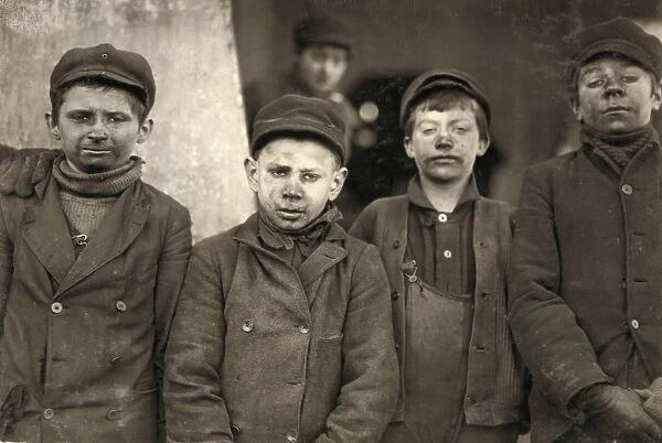 HINE: BREAKER BOYS, 1911. Four breaker boys working in #9 Breaker at the Hughestown Borough