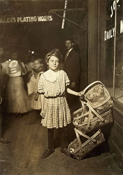 HINE: CHILD LABOR, 1908. Twelve-year old girl selling baskets on Market St. in Cincinnati, Ohio