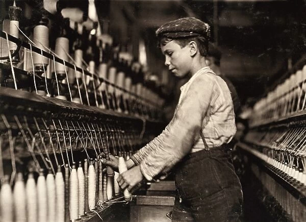 HINE: CHILD LABOR, 1909. A young doffer working in the Globe Cotton Mill in Augusta, Georgia