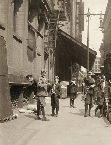 HINE: CHILD LABOR, 1910. Delivery boys at Nugents on Washington St. and Broadway in St
