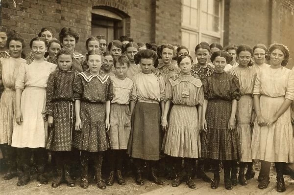 HINE: CHILD LABOR, 1910. A group of young spinners at the Pell City Cotton Mill, Alabama
