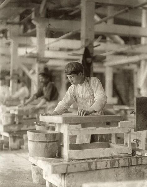 HINE: CHILD LABOR, 1910. A young boy polishing marble at the Vermont Marble Co