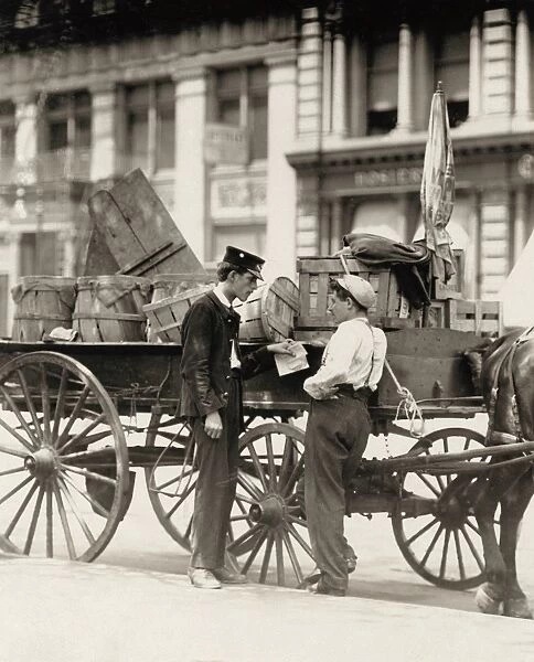 HINE: CHILD LABOR, 1910. A young messenger delivering a telegraph in Union Square, New York City