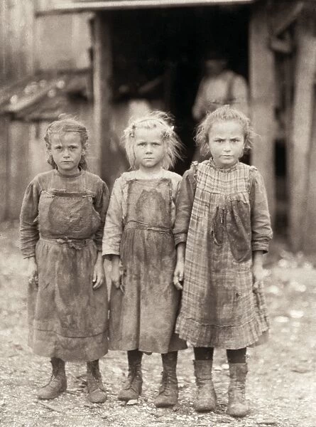 HINE: CHILD LABOR, 1911. Three young oyster shuckers at the Maggioni Canning Co