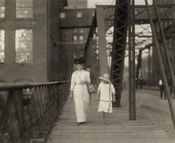 HINE: CHILD LABOR, 1913. A woman and a girl walking home from working at the Muscogee Mills