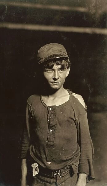HINE: CHILD LABORER, 1908. A young worker waiting for the night shift at a glassworks