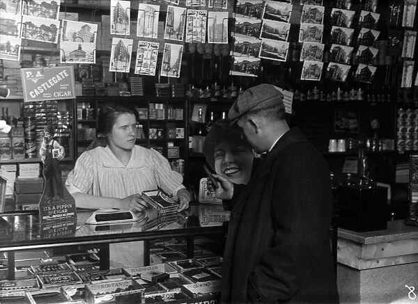 HINE: CIGAR STORE, 1917. 14-year-old Mary Creed selling cigars in a store in Boston