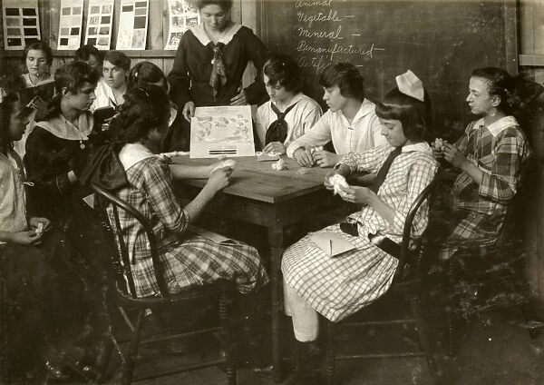 HINE: CONTINUATION SCHOOL. Young women studying textiles at a continuation school