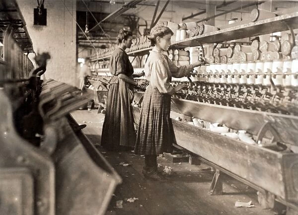 HINE: COTTON MILL, 1909. Pregnant woman and girl working in the Globe Cotton Mill in Augusta