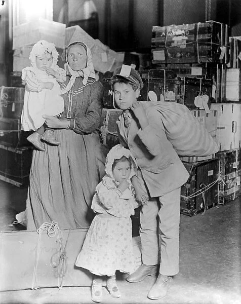 HINE: ELLIS ISLAND, 1905. An immigrant family at Ellis Island. Photograph by Lewis W