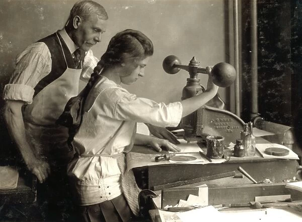 HINE: EMBOSSING SHOP, 1917. A 15-year-old girl cutting dies in Harry C. Taylors embossing shop