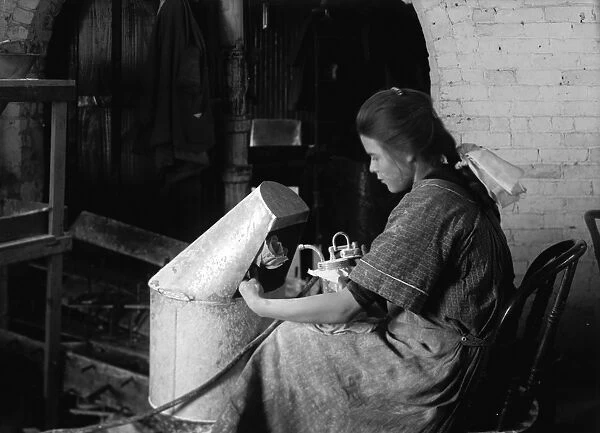 HINE: FLOWER FACTORY, 1917. 14-year-old Margaret Reddington powdering roses with