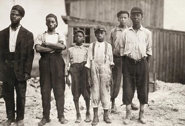 HINE: GLASS WORKERS, 1911. African American workers at the glass factory in Alexandria, Virginia