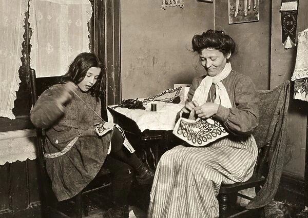 HINE: HOME INDUSTRY, 1910. A mother and daughter making embroidery in a tenement
