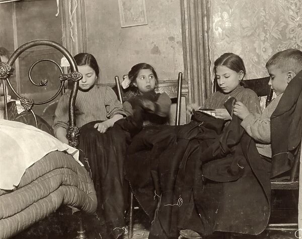 HINE: HOME INDUSTRY, 1910. Three young girls and a boy working on garments in a