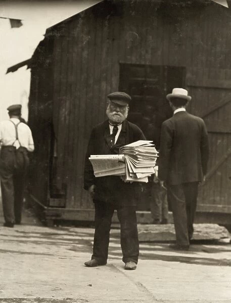 HINE: NEWS VENDOR, 1910. Old paper man on the Lower East Side of Manhattan, New York