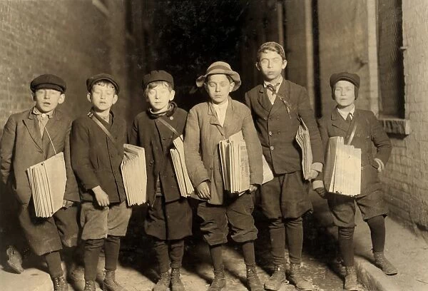 HINE: NEWSBOY, 1909. A group of newsboys at work at night in Newark, New Jersey