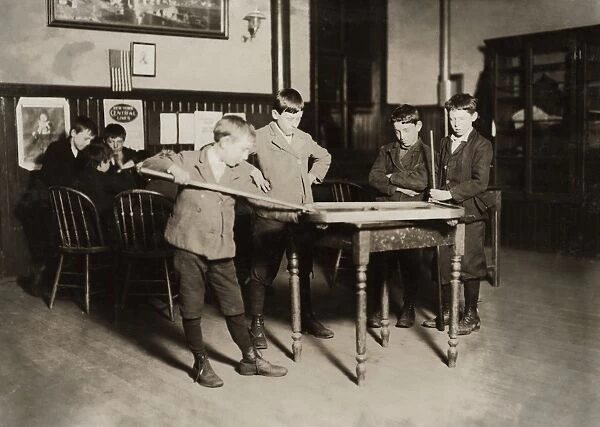 HINE: NEWSBOYS, 1909. Newsboy playing billiards at the United Workers Boys Club in New Haven