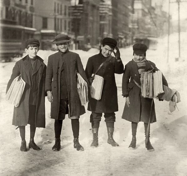 HINE: NEWSBOYS, 1910. A group of newsboys standing in the snow, Albany, New York