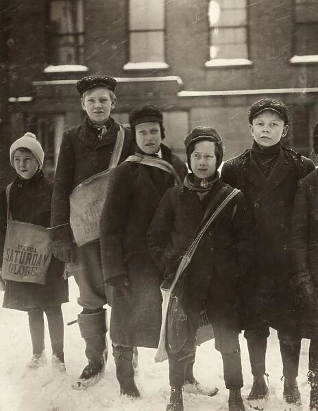 HINE: NEWSBOYS, 1910. A group of newsboys standing in the snow, Utica, New York