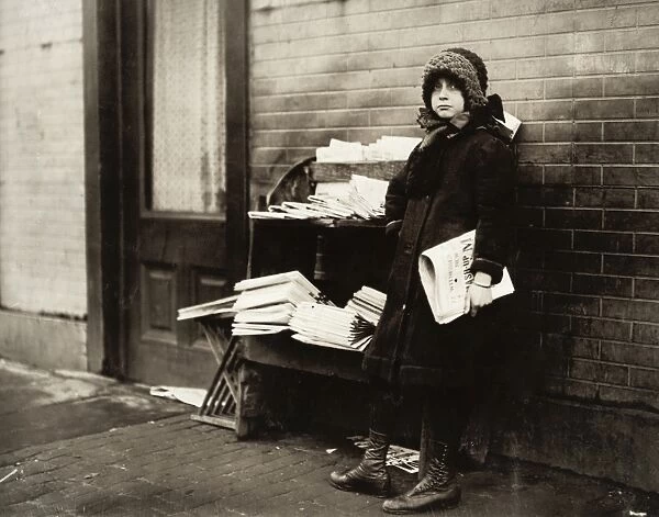 HINE: NEWSGIRL, 1912. A ten-year-old newsgirl tending a newstand on 4th and Garden