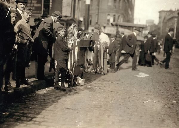 HINE: PEDDLERS, 1909. Boys peddling notions on the street in Boston, Massachusetts