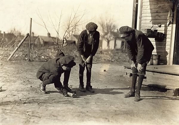 HINE: SHOOTING MARBLES, 1908. Young doffers at the Kesler Mfg