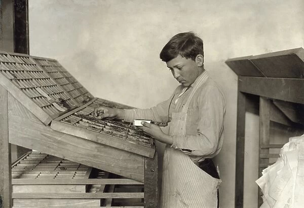 HINE: TYPESETTING, 1917. A schoolboy learning typesetting at the Training School