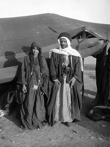 HOLY LAND: BEDOUIN CAMP. A Bedouin man and woman of the Adwan tribe, in the Middle East