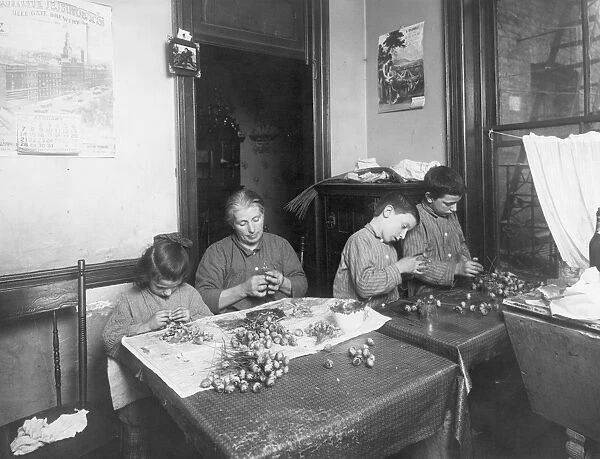 HOME INDUSTRY, 1912. Piecework labor in a New York City tenement, 1912