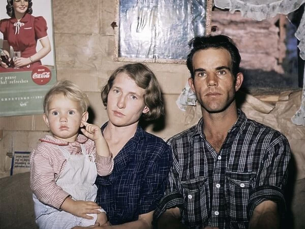 HOMESTEADERS, 1940. Homesteader Jack Whinery with his wife and youngest child in Pie Town
