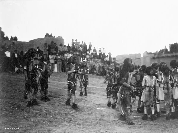 HOPI SNAKE DANCE, 1921. Hopi snake dancers, joined by antelope dancers (right)