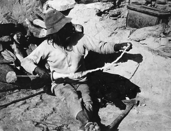 HOPI SPINNER, 1903. A Hopi man spinning cotton in the village of Oraibi, Arizona