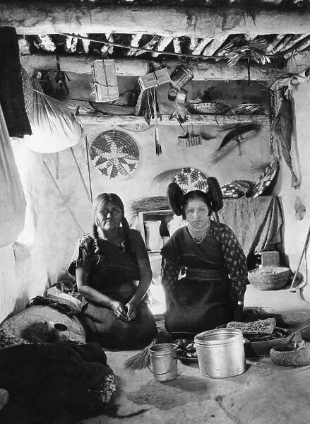 HOPI WOMEN, 1901. Two Hopi women inside a home at a pueblo in northeastern Arizona